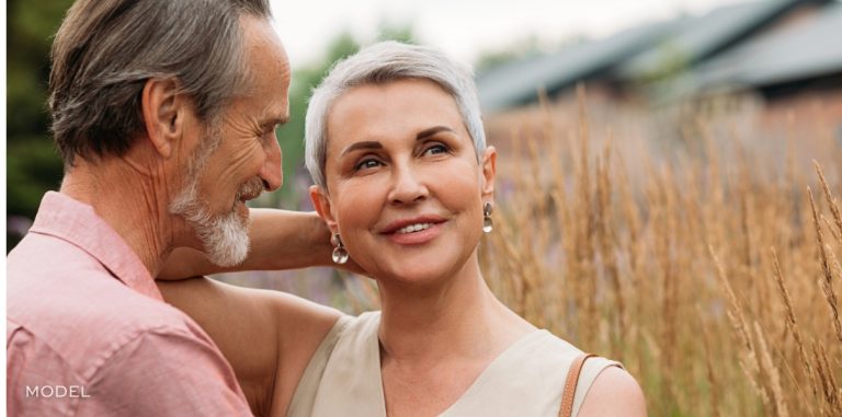 Mature couple outdoors enjoying confidence and vitality after prioritizing health wellness and aging well | william bruno plastic surgery