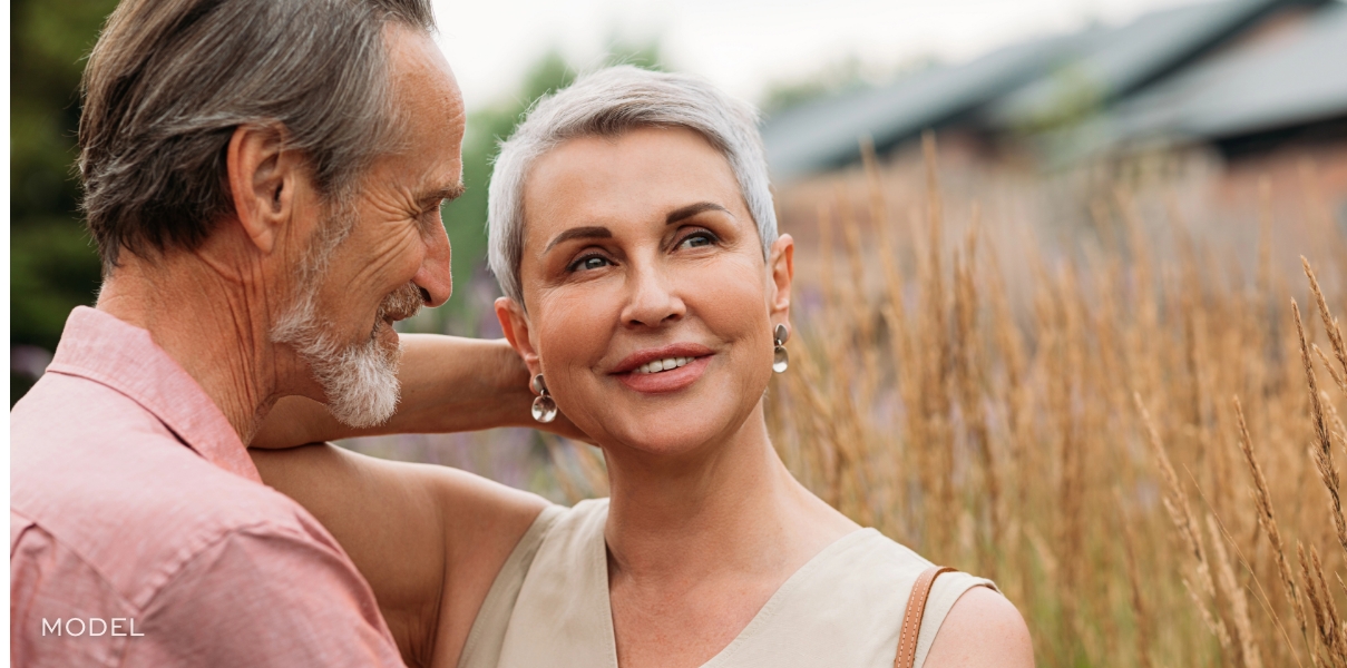 Mature couple outdoors enjoying confidence and vitality after prioritizing health wellness and aging well | william bruno plastic surgery